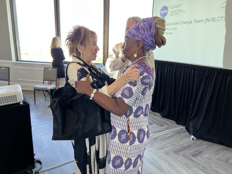 City of Tybee Island Mayor Shirley Sessions, left, embraces Dr. Mildred McClain at a NASA Sea Level Change Team meeting in Savannah, Georgia