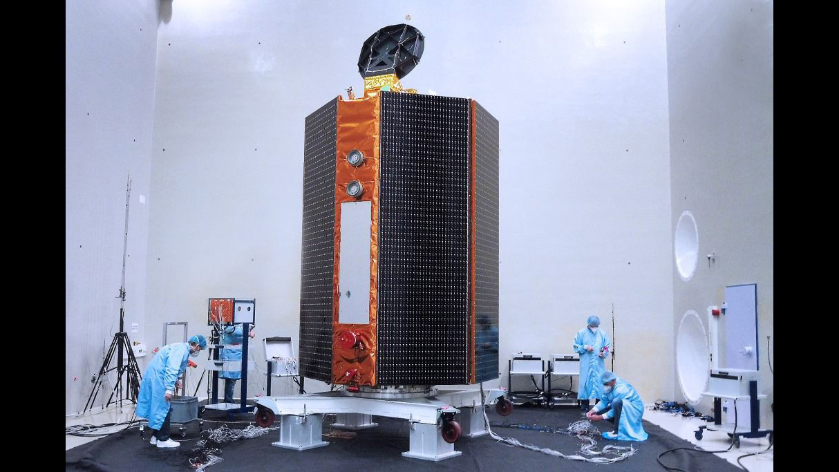 Mission team members perform acoustic tests of the Sentinel-6 Michael Freilich satellite in a chamber outfitted with giant speakers that blast the spacecraft with sound. This is to ensure that the high decibels associated with liftoff won't damage the spacecraft. Credit: Airbus › Larger view