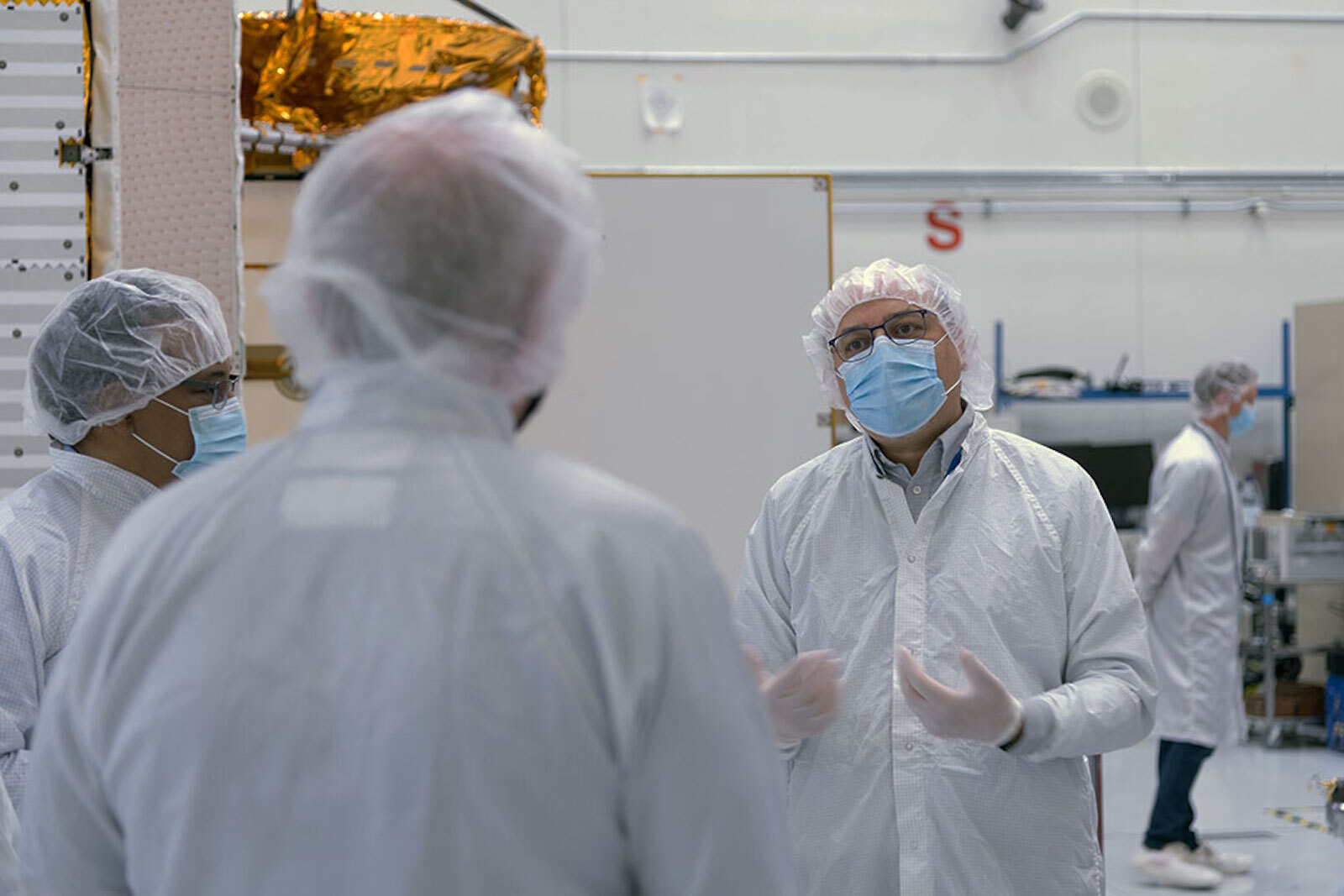 Project Manger Parage Vaze stands in the JPL clean room where the SWOT satellite is being assembled. The spacecraft will help researchers survey the amount and distribution of Earth’s surface water, including fresh water in lakes and rivers, as well as the ocean. Credit: NASA/JPL-Caltech