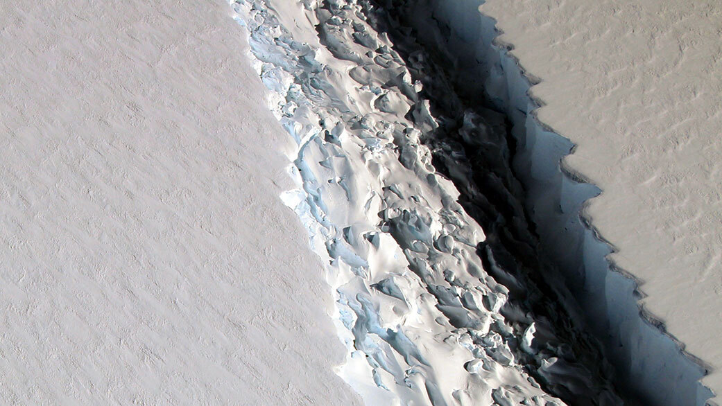 This 2016 photo shows a rift that, within a few months, widened even farther and and released a Delaware-size iceberg from Antarctica’s Larsen C ice shelf. The rough surface of ice mélange is visible on one side of the rift.