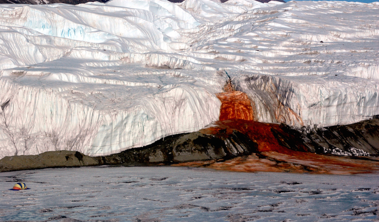 A buried saltwater reservoir could help color "Blood Falls," seeping from the end of East Antarctica's Taylor Glacier. A decade of observation has revealed lakes and streams hidden beneath Antarctic ice. Image credit: Peter Rejcek/Antarctic Photo Library/NSF